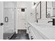 Modern bathroom with double vanity and hexagon tile shower at 3955 W 13Th Ave, Denver, CO 80204