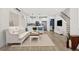 Bright and airy living room with white sofa and hardwood floors at 3955 W 13Th Ave, Denver, CO 80204