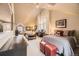 Large open bedroom with vaulted ceilings, multiple beds, and a designated office space at 76 S Garfield St, Denver, CO 80209