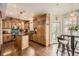Bright kitchen featuring an island, stainless steel appliances, and hardwood floors at 76 S Garfield St, Denver, CO 80209