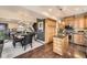 Open-concept kitchen and dining area featuring hardwood floors and modern appliances at 76 S Garfield St, Denver, CO 80209