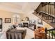 Cozy living room with a fireplace, hardwood floors, large windows, and elegant décor throughout at 76 S Garfield St, Denver, CO 80209