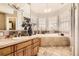 Bright bathroom with a large soaking tub and vanity with double sinks at 76 S Garfield St, Denver, CO 80209