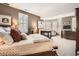 Spacious main bedroom featuring a fireplace, sitting area, and large windows at 76 S Garfield St, Denver, CO 80209
