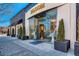 A Blooming storefront with planters and lots of glass for window shopping at 76 S Garfield St, Denver, CO 80209
