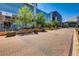Street view of a commercial district with shops, trees, and brick walkways at 76 S Garfield St, Denver, CO 80209