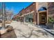 The row of storefronts features brick architecture and inviting entrances, offering a variety of shops at 76 S Garfield St, Denver, CO 80209
