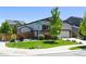 Charming home with well-maintained lawn and landscaped garden at 6049 Sandstone Cir, Erie, CO 80516