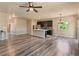 Bright open living space with hardwood floors and modern lighting at 6049 Sandstone Cir, Erie, CO 80516