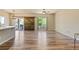 Bright open living space with hardwood floors and a barn door to the backyard at 6049 Sandstone Cir, Erie, CO 80516