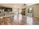 Open-concept living area featuring hardwood floors and abundant natural light at 6049 Sandstone Cir, Erie, CO 80516