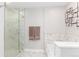 Clean bathroom with glass shower, soaking tub, and modern tile accents at 1700 Bassett St # 1803, Denver, CO 80202