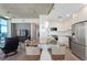 Bright kitchen featuring stainless steel appliances, a marble island, and an open floor plan at 1700 Bassett St # 1803, Denver, CO 80202