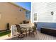 Small backyard patio with table and chairs at 9084 E 37Th Ave, Denver, CO 80238