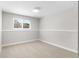 Spacious basement area with neutral carpet and a window at 9275 W Euclid Ave, Littleton, CO 80123