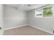 Finished basement area with a large window offering natural light at 9275 W Euclid Ave, Littleton, CO 80123