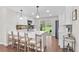 Modern kitchen featuring white cabinetry, stainless steel appliances, and an island with seating at 9275 W Euclid Ave, Littleton, CO 80123
