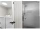 Bright laundry room featuring a new washer and dryer next to a frosted-glass shower at 9275 W Euclid Ave, Littleton, CO 80123