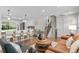 Open living area with hardwood floors connecting living room, kitchen, and staircase at 9275 W Euclid Ave, Littleton, CO 80123