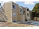 Exterior building featuring wood siding, multiple windows, and an accessible parking spot at 10792 E Exposition Ave # 353, Aurora, CO 80012