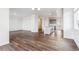 Open-concept living space with wood floors seamlessly connecting to the kitchen at 28621 E 8Th St, Watkins, CO 80137