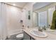 Bright bathroom featuring a single sink vanity and a full bath/shower combo at 8204 S Vandriver Way, Aurora, CO 80016