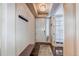 Inviting entryway featuring a coat rack, bench, and stylish lighting fixture, creating a welcoming first impression at 8204 S Vandriver Way, Aurora, CO 80016