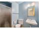 A full bathroom with a step-in shower and single sink at 8675 W 60Th Ave, Arvada, CO 80004