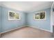 This bedroom features two windows that provide great light at 8675 W 60Th Ave, Arvada, CO 80004