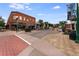 Quaint brick building in a vibrant downtown area, featuring outdoor dining and a lively atmosphere at 8675 W 60Th Ave, Arvada, CO 80004