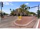 Charming commercial building at a bustling intersection, featuring outdoor seating and street-side amenities at 8675 W 60Th Ave, Arvada, CO 80004