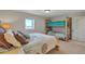 Bedroom with a queen bed, bunkbeds made of wooden logs, and view of outside at 1549 Hillside Cir, Sedalia, CO 80135