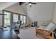 Bright bedroom featuring hardwood floors, a ceiling fan, and a computer desk at 1549 Hillside Cir, Sedalia, CO 80135