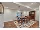 Dining room featuring a wood table with seating for six, set on an area rug, and a china cabinet at 1549 Hillside Cir, Sedalia, CO 80135