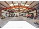 Large metal garage or workshop space, suitable for a variety of hobbies and activities, with high ceilings at 1549 Hillside Cir, Sedalia, CO 80135
