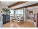 Cozy sitting area featuring scenic views, wood beam ceilings and comfortable seating at 1549 Hillside Cir, Sedalia, CO 80135