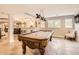 Finished basement features a pool table, wet bar, and a cozy seating area for relaxing and entertaining at 18963 E Long Ave, Centennial, CO 80016
