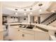 Basement with bar and pool table, as well as a view of the stairway and living room at 18963 E Long Ave, Centennial, CO 80016
