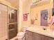 Bathroom featuring a glass shower, gray vanity and mirror at 18963 E Long Ave, Centennial, CO 80016