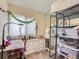 Bright bedroom features ample storage, a sewing station, and an open feel at 18963 E Long Ave, Centennial, CO 80016
