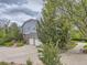 Charming home with a spacious driveway, two-car garage, and lush landscaping for added curb appeal at 18963 E Long Ave, Centennial, CO 80016