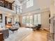 Bright living room with high ceilings, large windows, and an open floor plan at 18963 E Long Ave, Centennial, CO 80016