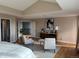 Cozy main bedroom featuring hardwood floors, sitting area, and modern decor at 18963 E Long Ave, Centennial, CO 80016