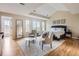 Bright main bedroom features sitting area, large windows, wood floors, and vaulted ceilings at 18963 E Long Ave, Centennial, CO 80016