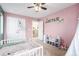 Bedroom with toddler bed and pink walls at 4715 Crestone Peak St, Brighton, CO 80601