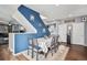 Dining area with table, chairs, and blue accent wall at 4715 Crestone Peak St, Brighton, CO 80601