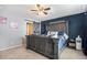 Large main bedroom with a ceiling fan and dark wood furniture at 4715 Crestone Peak St, Brighton, CO 80601