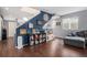 Playroom with blue accent wall, toy area, and hardwood floors at 4715 Crestone Peak St, Brighton, CO 80601