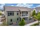 Charming back exterior with a balcony, backyard patio and manicured lawn, perfect for entertaining at 1754 W 66Th Ave, Denver, CO 80221