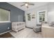 Cozy Bedroom with crib, chair, and natural light from multiple windows at 1754 W 66Th Ave, Denver, CO 80221